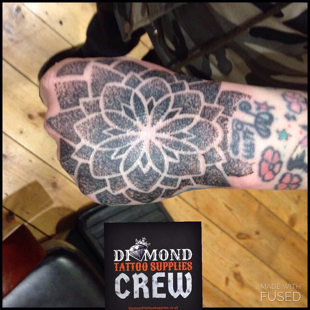 Dotwork hand piece from a while back, not the best photo and work on the arm not done by me #blackwork #dotworktattoo #handtattoo #traditionaltattoo #girlswithtattoos #southwesttattooers