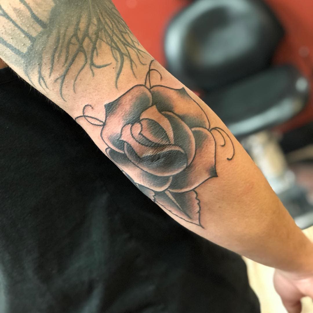 Rose on elbow done by @mike.irons get in to make your appointment today with mike! #tattoos #rose #elbowtats #flatblacktattoo #carsoncitytattoo