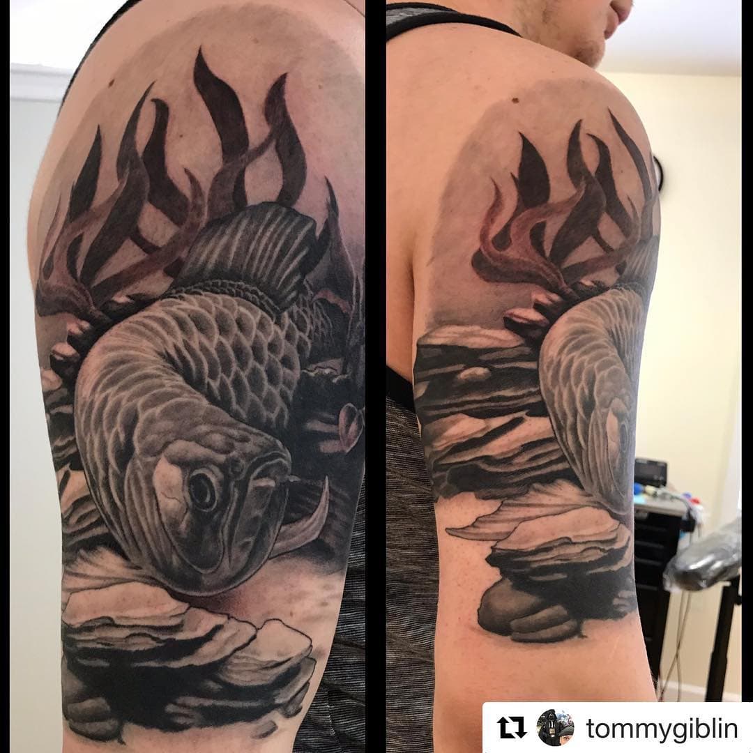 #Repost @tommygiblin with @get_repost
・・・
A cool #arowana fish. Lots of fun doing something out of the ordinary.
.
.
.
#cypherink #cypherinktattoos #tommygiblin #blackandgreyrealism #tattoosofinstagram #tattoooftheweek #tattoooftheday #blackandgreytattoo #inkfusion #inkfusionempire #skinandinkmag #skinandinkmagazine