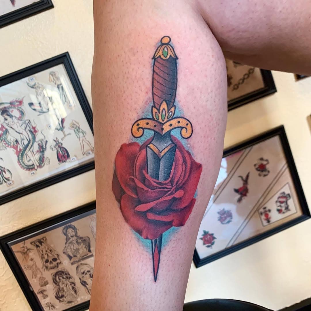 Style crossover done by @jinks.tattoo .
.
.
#tattoo #tattoos #art #traditional #traditionaltattoo #realism #rose #dagger #flower #color #boise #boisetattooer #colortattoo #pretty #cute