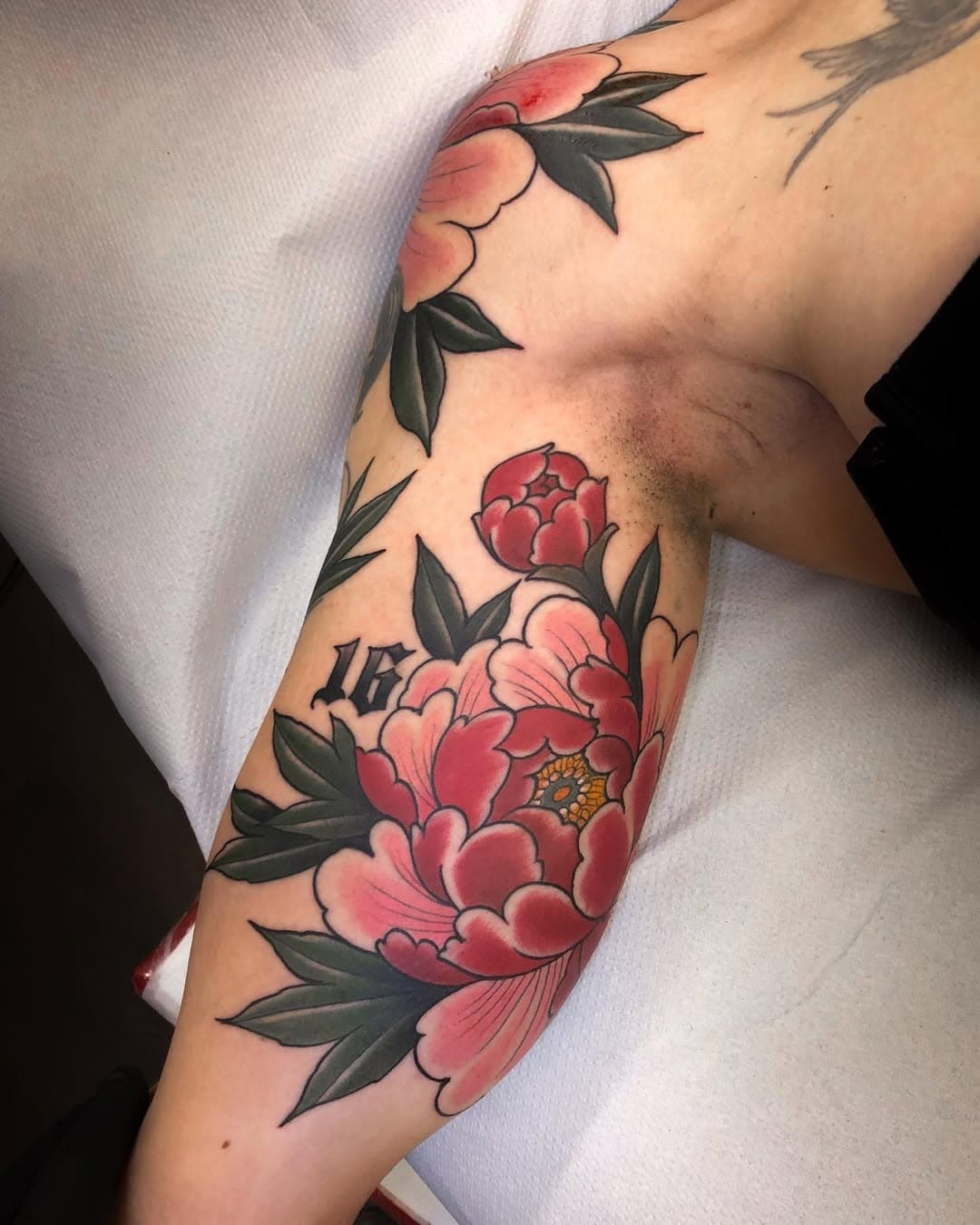 Freehand peonies by @tattoosbytoby