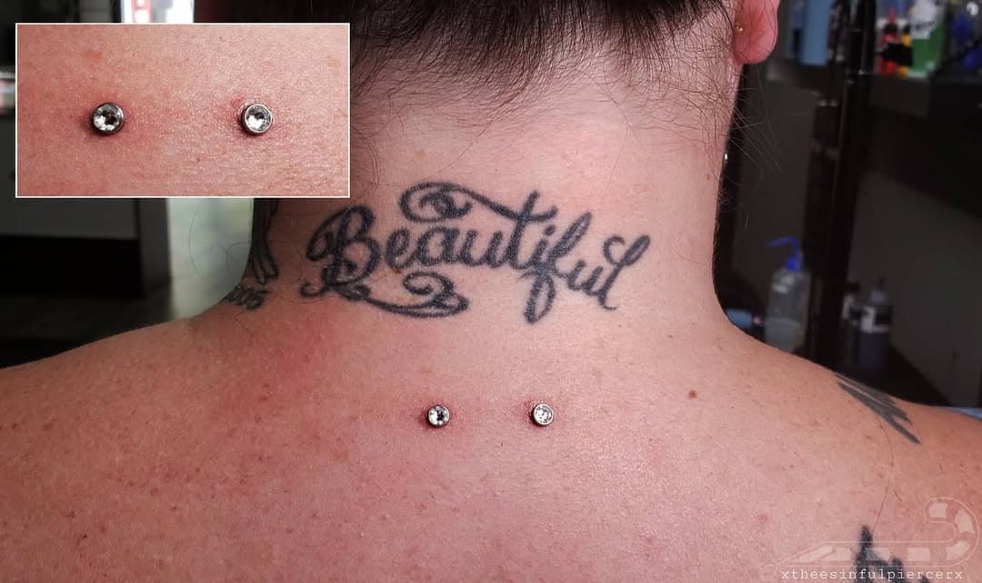 Removed the 14G 90° Surface Barbell  on this lower Nape Piercing && replaced it with these paired set of 3mm Titanium Implant Grade Single Point Surface Anchors AKA MicroDermal Implants. 
.
.
.
.
.
#MonstersInk #BayAreaBodyPiercer #FemaleBodyPiercer #CandyTheePiercer #AlbanyCa #MicrodermalImplants #NapePiercing #SinglePointSurface #TitaniumJewelry #GrabNStab