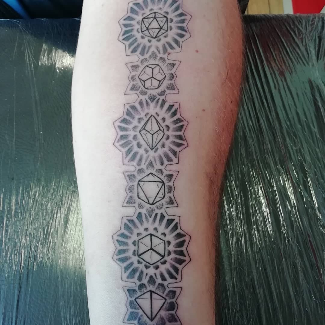 Dice with geometric patterns! #dnd #blackandgreytattoo #belfasttattoo #forearmtattoo #dice #ouch