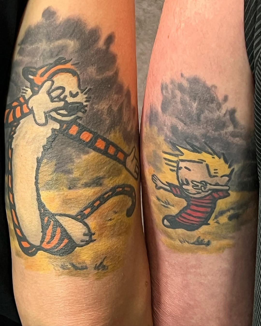 Matching his/hers Calvin and Hobbes as Mia Wallace and Vincent Vega dancing in Pulp Fiction. #couplegoals #couplestattoos #pulpfiction #pulpfictiontattoo #calvinandhobbes #calvinandhobbestattoo #matchingtattoos #nuclearink #comic #comicbooks #comicbooktattoo #tattoo #colortattoo #watercolortattoo