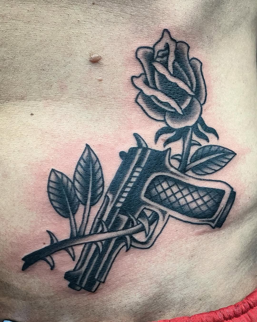 Thanks to Nik for coming back for this #gun and #rose #tattoo. @miamiinklovehate