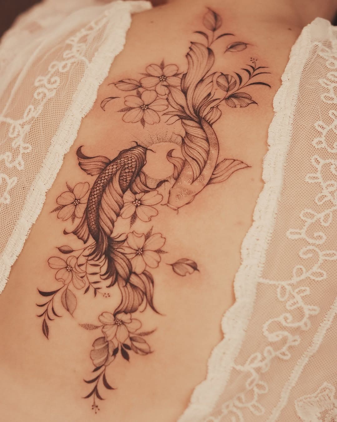 Courtney’s latest tattoo masterpiece dances across her back, a symphony of floral and aquatic elegance. 🌸🐟 A majestic koi fish, symbolizing luck and perseverance, weaves through a delicate array of blossoms and leaves, embodying grace and the flow of life. Every detail tells a story of beauty in motion. #KoiTattoo #FloralArt”

📩 for bookings check the links below 
www.brunotats.com 
https://bit.ly/Brunotats

 #tatuagem #flores #brazil #love #art #instagood #tattoo #flowers #photooftheday #cute #follow #instagram #uk
#pepax #pepaxofficial