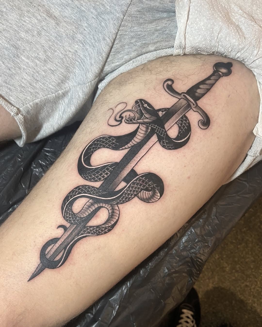 • Snake and dagger by @crooktattoo 🐍🗡️

• Scott has a limited spaces left this month, to book in with Scott DM/Email us 🖤

#tattoo #tattoos #blackandgreytattoo #snake #snaketattoo #snakeanddagger #snakeanddaggertattoo #neotrad #neotraditional