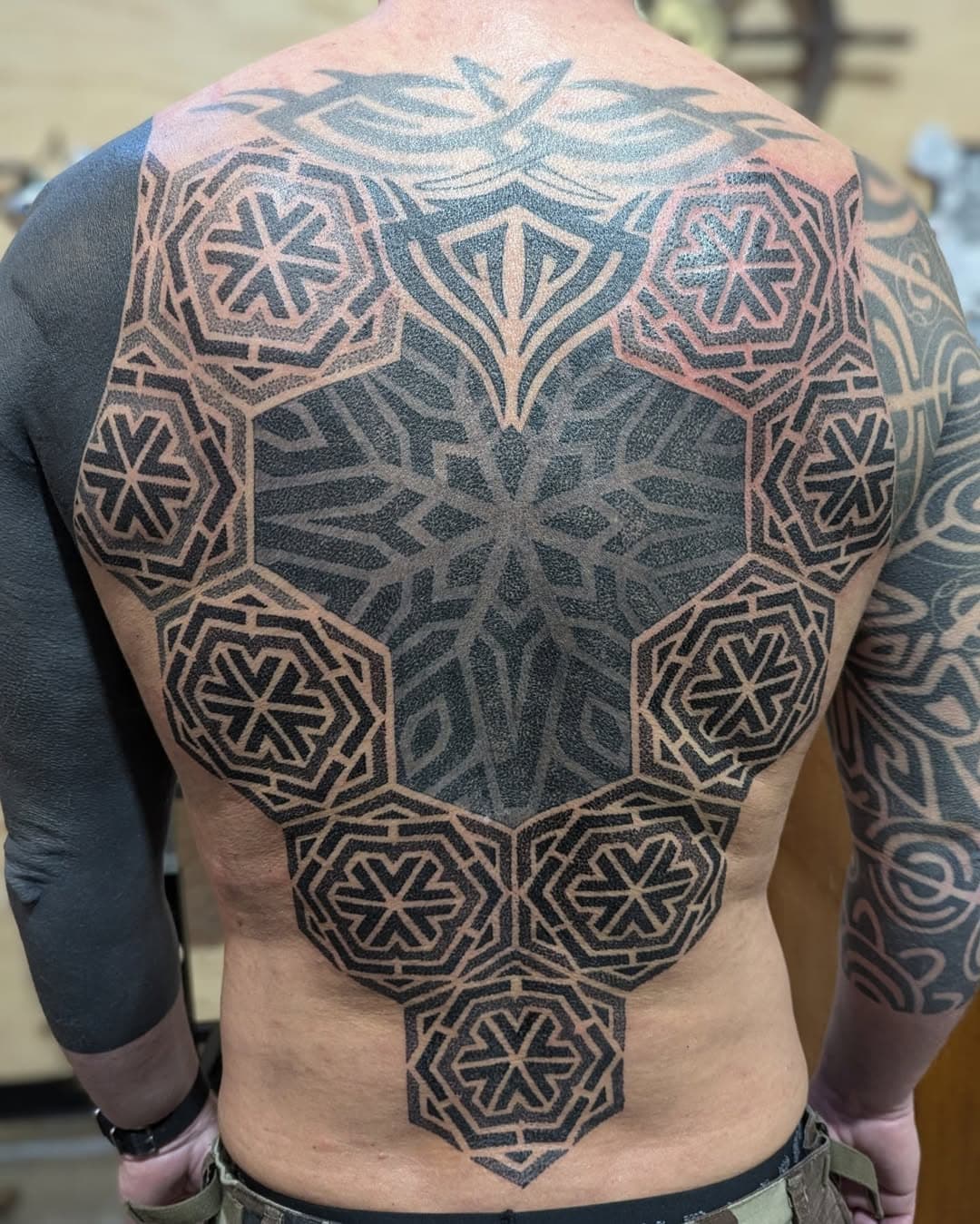 Really happy with how Geoff's back is coming along, working around some existing 90's tribal.

#chrisjonestattooer #oceangrovetattoo #geometrictattoo #backpiece #oceangrove #bellarinepeninsula #patterntattoo #dotworktattoo #mandalatattoo #oceangrovetattooartist