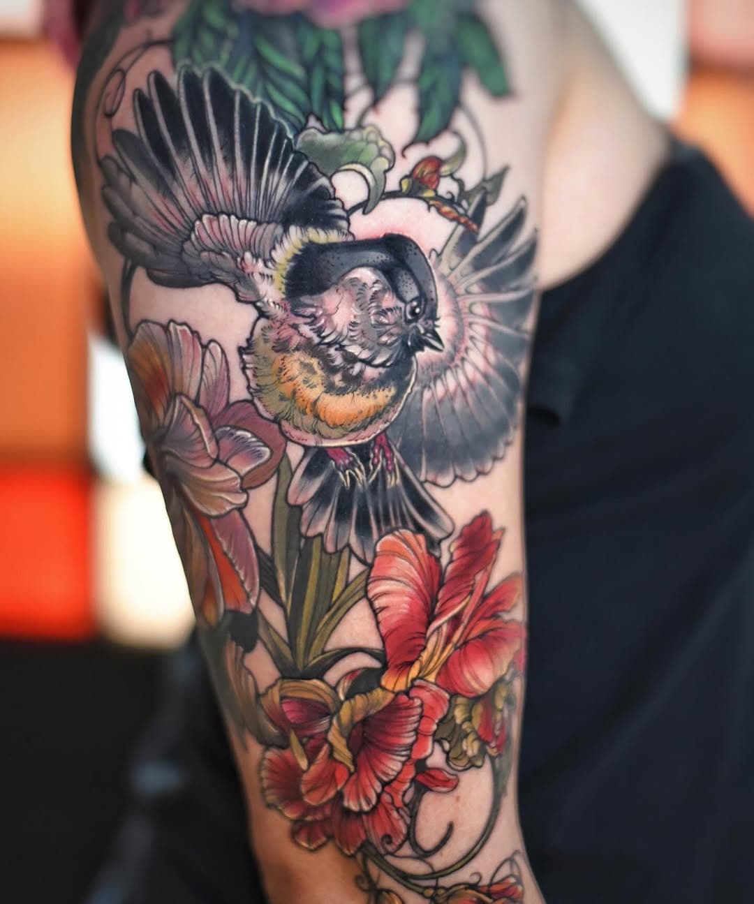 Chickadee and lower flowers we added to a preexisting shoulder cap that was from another artist. The challenge was to balance the piece while keeping it light and airy.