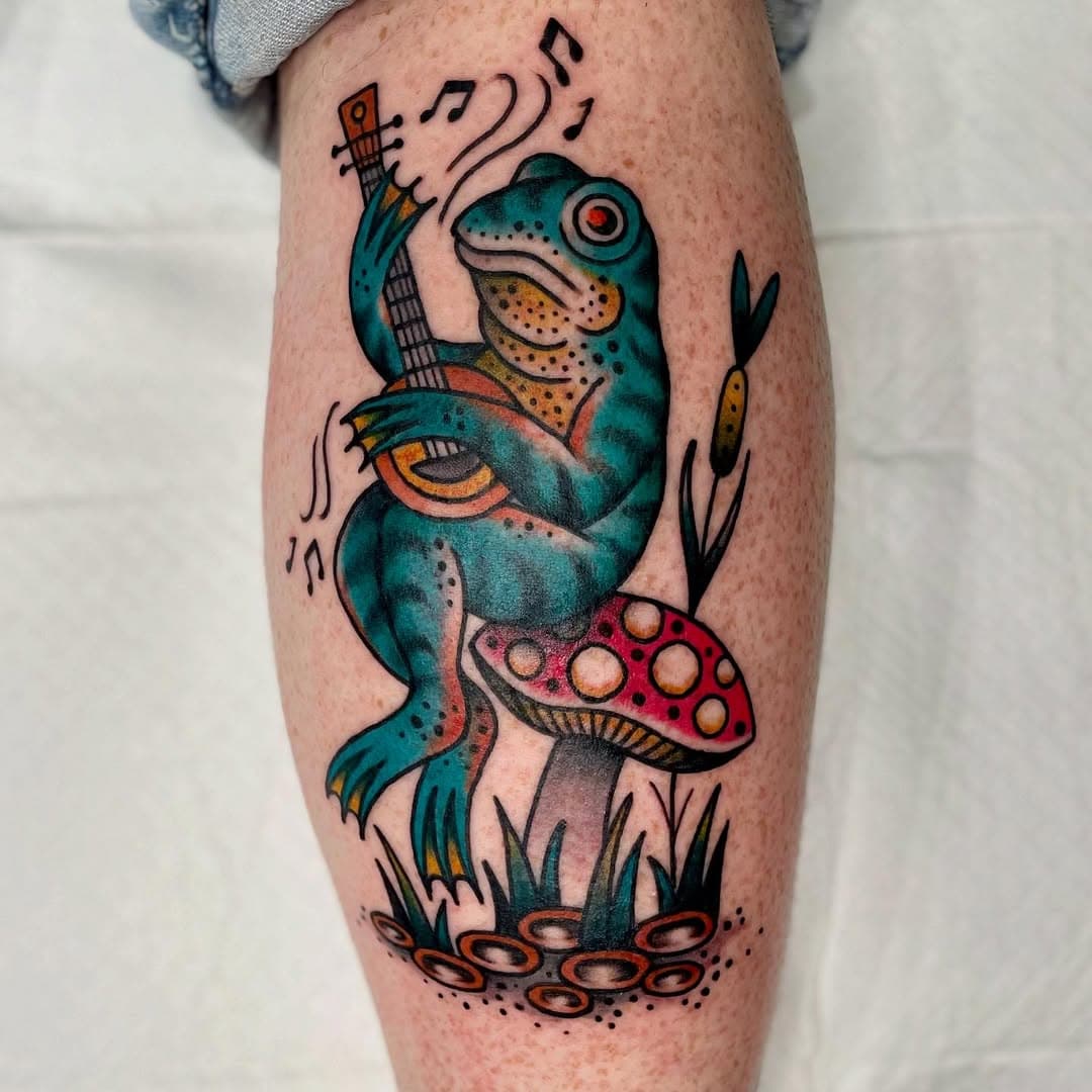 *Edit* Posting this again. Hot tip don’t edit photos under harsh hospital lighting 👍
.
Leaning into my amphibian era 🐸🍄🪕 for Clare! Thank you 🙏 Done @sisters__inked 
.
.
.
#frog #frogtattoo #bankofrog #colourtattoo #qttr #transartist