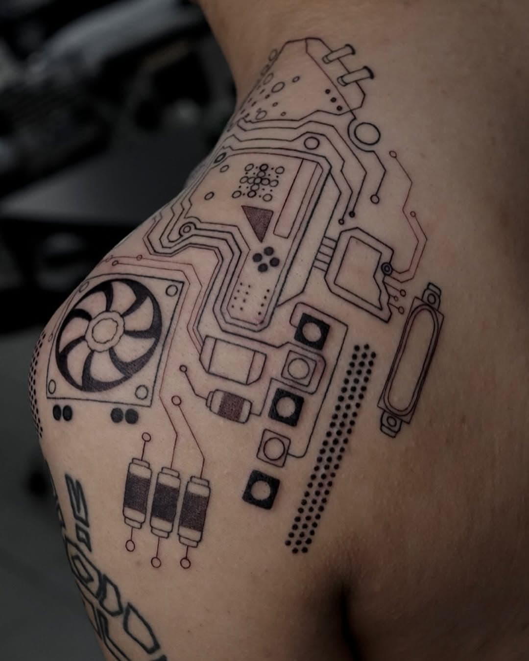 My client asked for a bio mechanical shoulder piece but he favored circuitry, electronic wiring, computer chip type elements. This was a little challenging for me because I wasn’t familiar with how circuits all connect together. 

After doing some research this is what I came up with! (Tons of straight lines and circles 😨😵 every tattoo artists nightmare). Finished back in August 2023