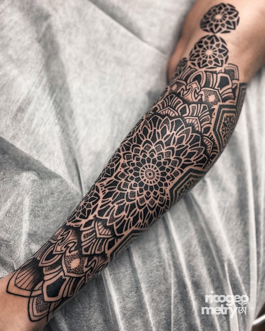 I have a stack of folders filled with a print of every single tattoo I’ve ever made - I’d love to sort through them one day out of curiosity and count up how many mandalas I’ve tattooed. Where patterns are more universal and transferable between designs, I create every single mandala from scratch for each individual appointment to ensure they are always unique and personal. I’ll often design this immediately after reading through previous email exchanges with a client, while I’ve got a part of their energy in my focus, to try and encapsulate a design that will resonate on a deeper level.
ༀ 
#geometrictattoo #mandalatattoo 
@geometricatattooapp @criticaltattoosupply @dynamiccolor @anchored_stencil @blackclaw @spirittattooproducts @tatsoul @geometrip @geometrip_small @ellipsistattoo
