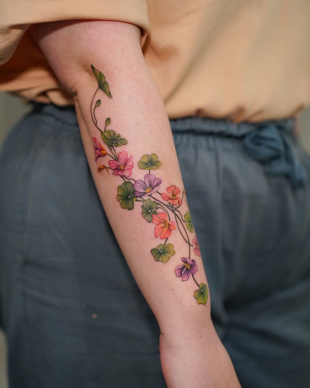 Thrilled to have tattooed this nasturtium design for Bel! Bel had asked for a nasturtium tattoo, and I happened to have a pre-drawn design that fit Bel’s vision perfectly. So glad it found its home! Thank you Bel! 

#flower #floral #botanicaltattoo #finelinetattoo #londontattoo #delicatetattoo #colourtattoos