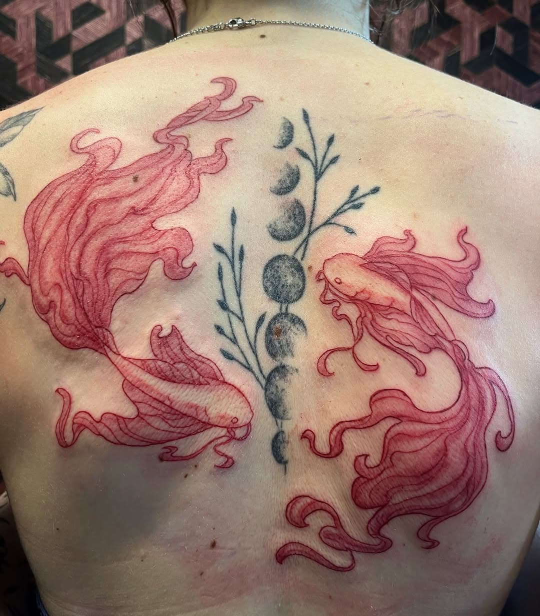 Today we added this 2 red fish around an old tattoo on the spine,was super fun project,thanks for coming!
done at @inkorporated.amsterdam 
.
.
.
#tattooamsterdam
#amsterdamtattoo 
#tattooideas 
#fish
#redink 
#finelinetattoo