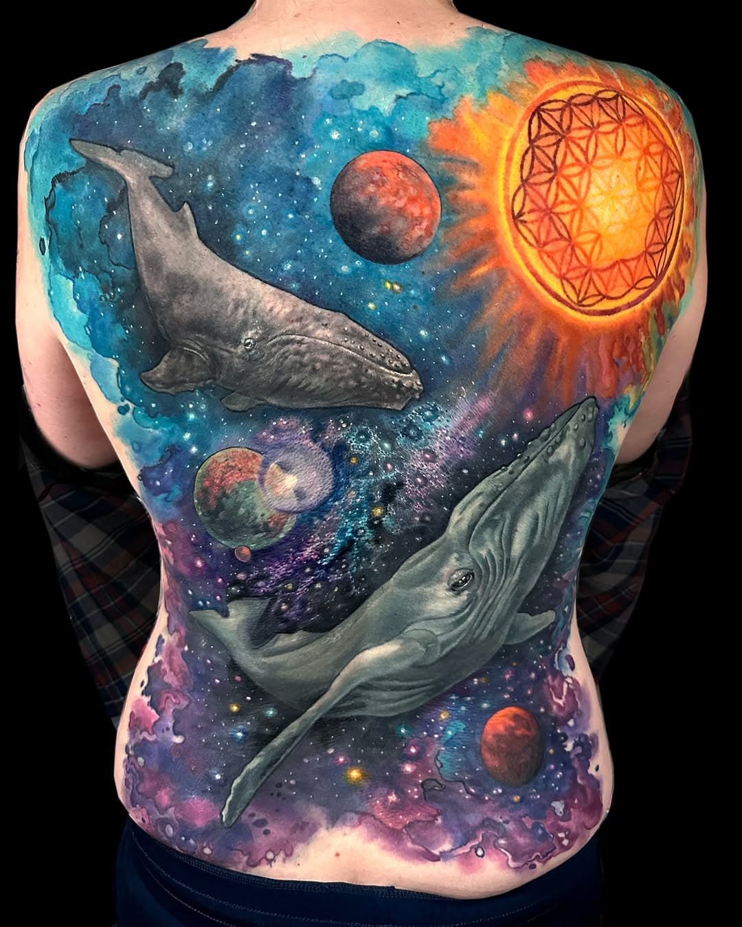 Finished Emily's back! 
It took a long time. Many many hours. Lots of plasma, sweat and tears. It's a cover up of the black and grey stars everyone got in the early 2000's. Also one of my favorite parts was actually a happy accident. She had a reaction to some numbing cream which resulted in like a webbed pattern that we used to texturize the inner galaxies and stars. I love this tattoo, love Emily, love my job, love love. 

#tattoosbykatecrane #direwolftattoostudio #watercolortattoo #galaxytattoo #floweroflifetattoo #whaletattoo #whalesinspace #coveruptattoo #backpiece #fantasybackpiece #fantasytattoo #stencilstuff #inkjecta #nuematattoomachines #thousandoakstattooartist #socaltattooartist #allthecolors