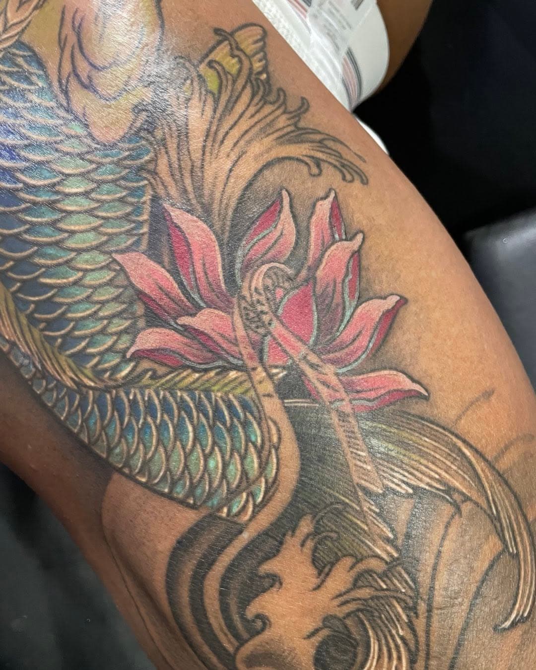 More work done on this leg. Nice color on the lotus. Healed #lifeartcreations #tattoo #losangelestattoostudio #koitattoo #lotustattoo #thightattoo #colortattoo #japanesetattoo #niceflow #darkskintattoos #gayswithtattoos #lgbtowned