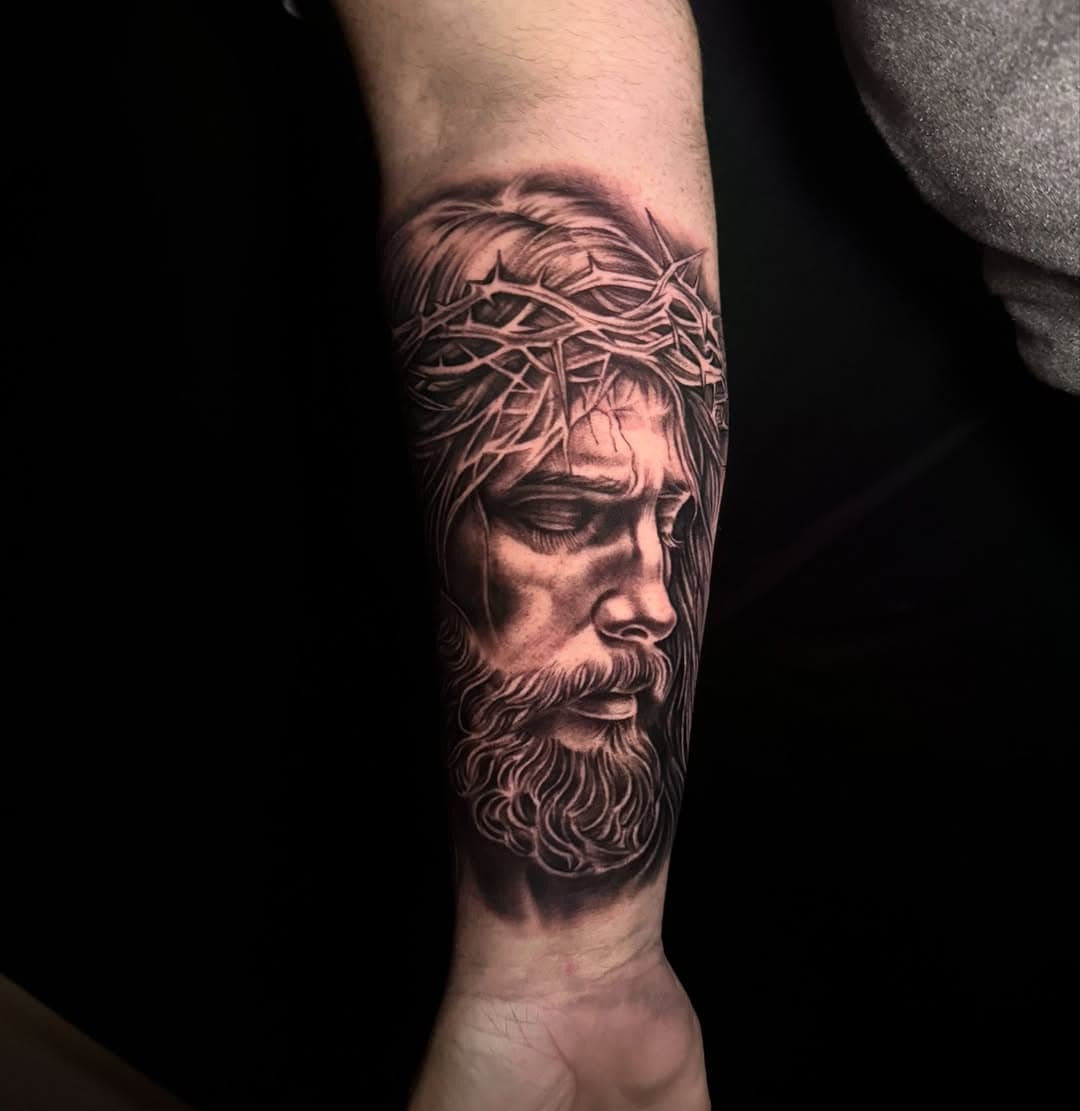 Jesus Christ, forearm piece to start off on a sleeve we will be working on in the future. About ten hours of work, sat like a rock 🤘🏾 it’s always hard to sit for that long time especially if you’re up and running on the daily. 

Booking for Mid January/Feb

#oklahoma #oklahomatattoo #oklahomatattooartist #oklahomatattoocollective #bng #bngtattoo #dynamicink #fkirons #ink #tattoos #jesus #jesuschrist #blessed #itseverydaybro #todolosdias #2024 #endoftheyear #jesuspower #blackandgreytattoo  #supplies #tatsoul #recoveryaftercare @crybabytattooproducts #lovemycareer #cherishmyclients #humbledbylife #inkfamily