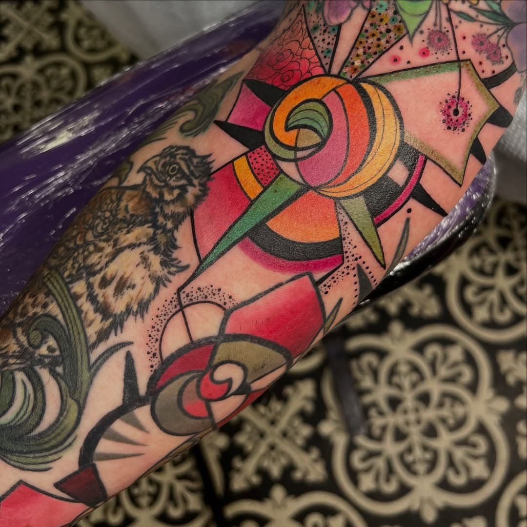 Fresh geometry around a vintage hawk and woodpecker…I like to mix and match my style… @punkturetattoostudio