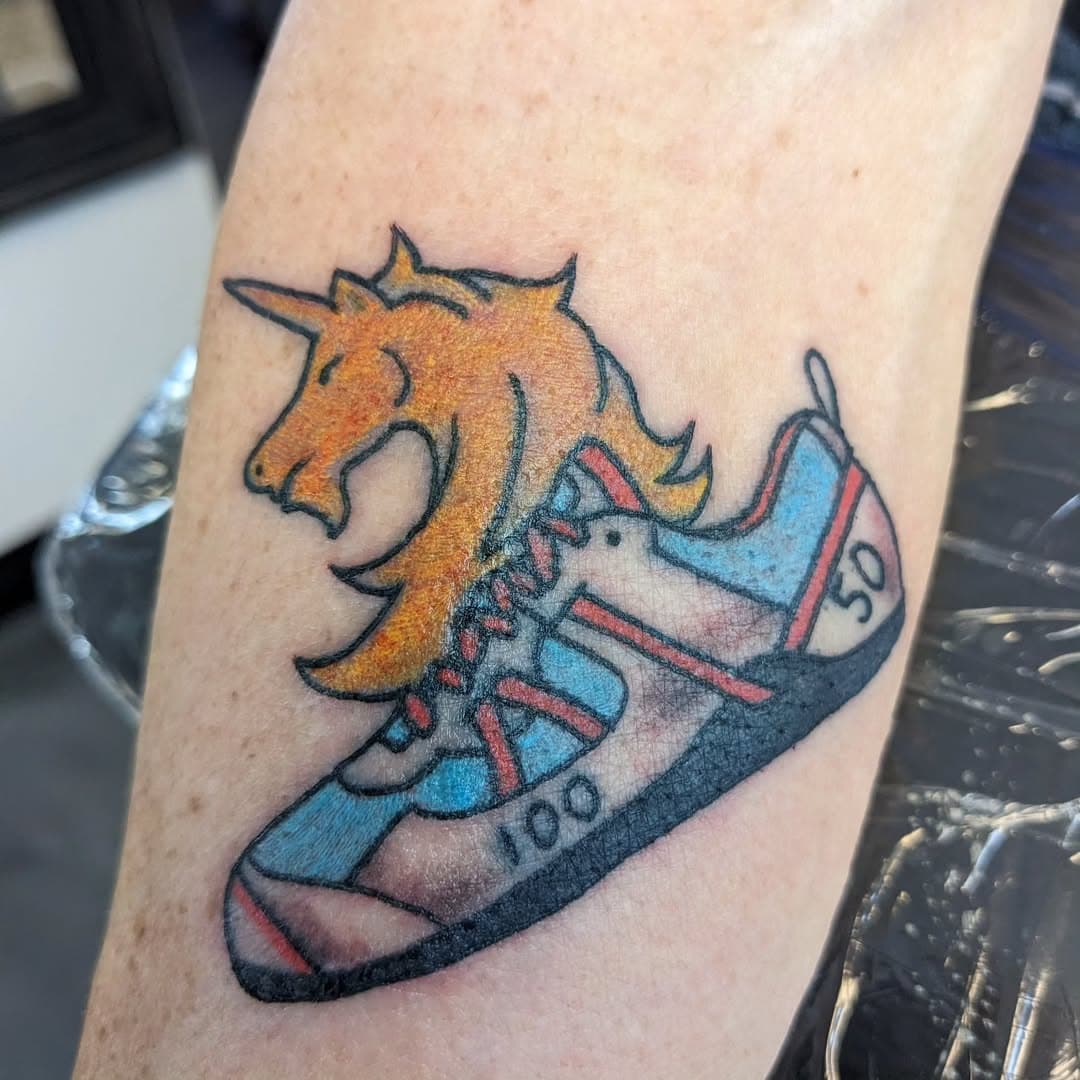 My last tattoo for 2024 has a lot of meaning...
Carla loves to run in marathons and has made it through a number of milestones. The unicorn is the logo for the Boston Marathon. The 100 on the shoe is for 100 miles. The 50 and red white and blue are for all 50 states. Thanks for choosing me to do this one, Carla! 
Hoping you all have a safe and happy NYE! Peace and prosperity to you all!