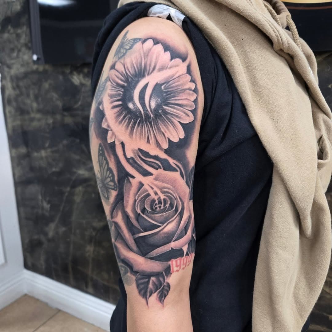 A great start to this sleeve. This was a lot of fun, and thank you all to a great year filled with love and support. Let's have another great year. Send a message if you are interested in am currently booking.

#blackandgreytattoos #blackandgreyink 
#blackandgreyrealism #rosetattoo #sunflowertattoo 
#inlandempire #losangeles #hesperia #bridgecitytattoo #mividaartistica #localtattooartist #floraltattoo #gothicstyle #gothboiclique