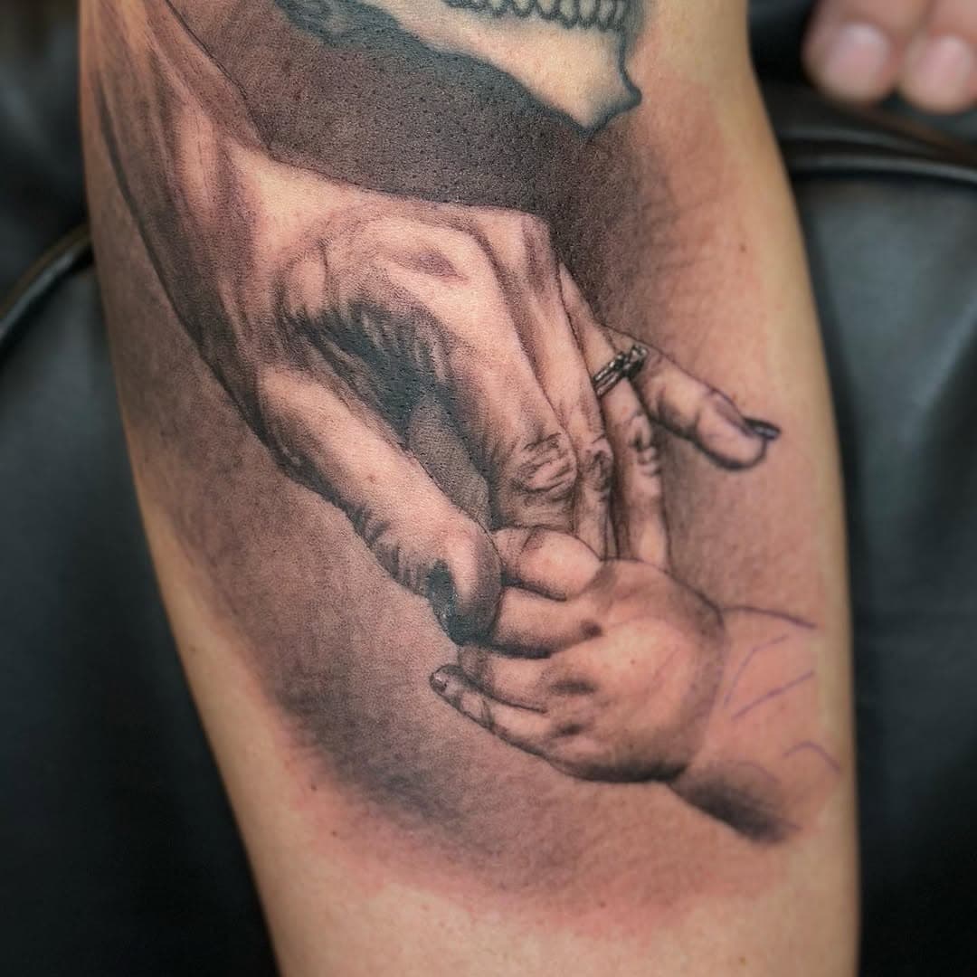 A mothers hand @heartanddaggertattoo13