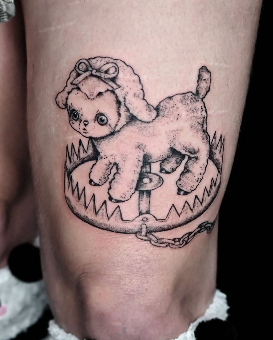 Sacrificial Lamb in a bear trap tattoo above the knee. Tattoo by Fred @phoebustattoo St Pete FL. 
 Text or call 727-666-1329
Visit Website: https://fufred.com

#sacrificiallamb #lamb #darkart #darktattoo #detailtattoo #phoebustattoos #stpetersburgflorida #tattooshop #tattooart #tattooartist #tampatattooartist #girltattoos #stpetefl #tattoos #lambtattoo