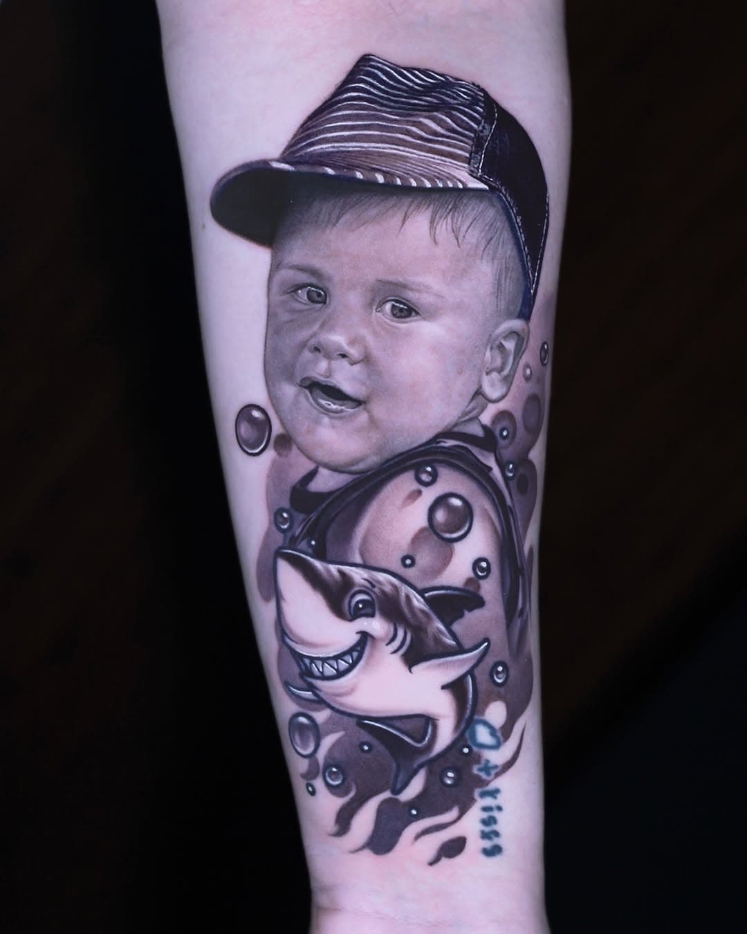 I loved being able to add the cute shark element with this one! The face is healed in this photo, all the rest is fresh #babyportrait #familyportrait #blackandgreytattoo #realistictattoo #portrait #chicago #chicagotattooartist