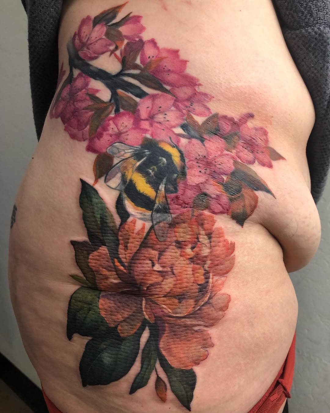 I love the way these flowers cascade down her hip. She is so fucking tough, cause this is not an easy spot to sit for. Our bodies are truly beautiful in everything they can do, so celebrate your strength and beauty! #austinwest #revivalartcollective #tattooartist