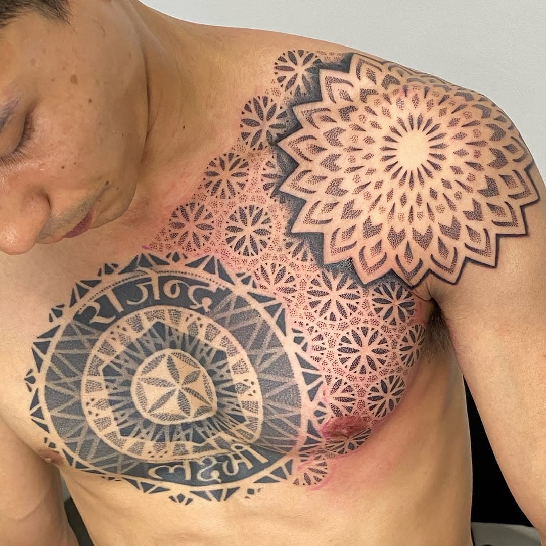 I added to another artists central chest piece with this flower of life inspired geometric pattern and shoulder mandala 🩶🩶🩶 thanks for looking 🙏🏽 #mandalatattoos #geometrictattoo #floweroflife #dotwork #dotworkers #blackink #blackinktattoo #sacredgeometrytattoo #sacredgeometry #5D #soul #spirit #divination #broadstairs #kent #thanet #vegantattoostudio