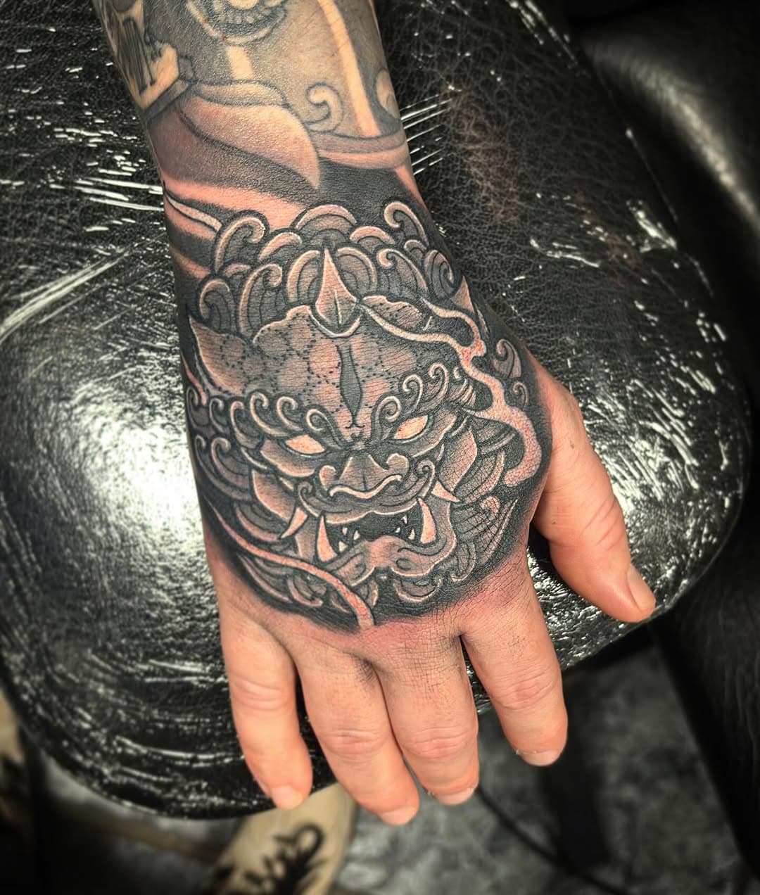 Hand design done today. Thanks for looking #fuudog #fudogtattoo #fudog #tattoo #tattoos #handtattoo #blackandgreytattoo