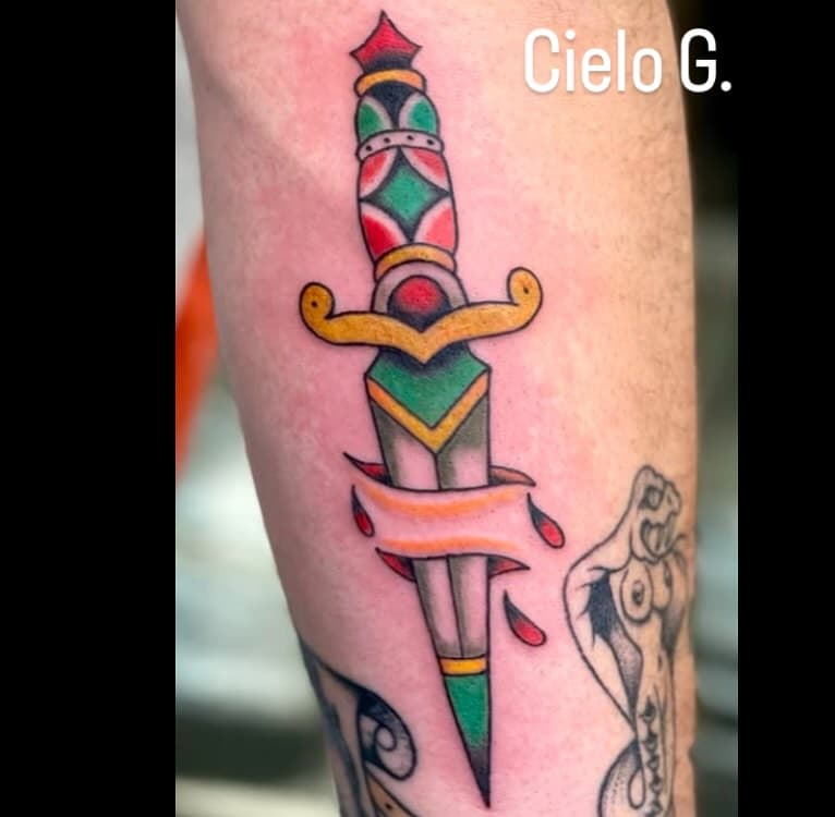 Killer 🗡️ done by: @cielo.tattoos #tattooshop #tattooart #orangecounty #orangecircle #americantraditionaltattoo #colorful #art #supportsmallbusiness #fyp #explore #tattooers #boldtattoos #finelinetattoo #thankyou