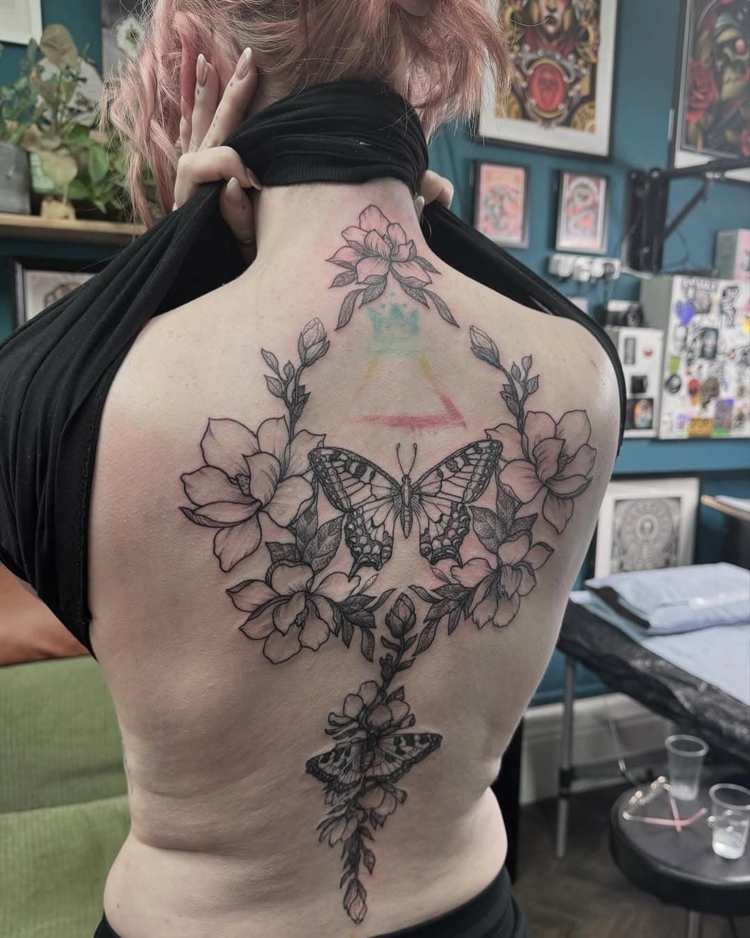 Butterflies and Magnolias for Laura. Designed to wrap around her existing tattoo. Completed in a for four session. 🖤