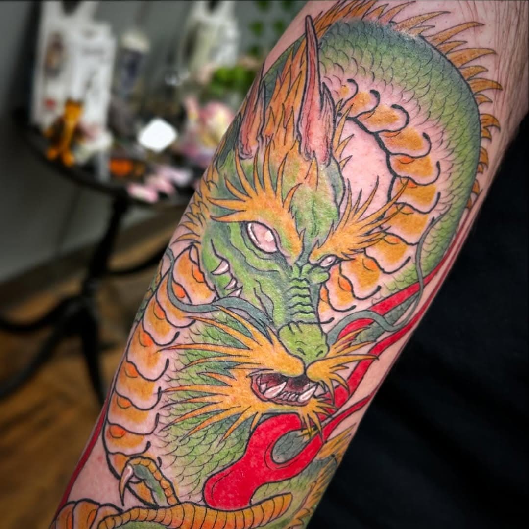 Got to do this really cool dragon! Loved the colors and how it turned out :) 
~Japanese inspired~
Hope everyone is surviving this year so far! It’s been a rough start but I’m determined to make it my year. Despite everything going on in the world, I hope to make it a better place. 
Happy Saturday 🫶🖤

Made with the best @peachtattoosupply @peachtattoo_official @alliancetattoosupply @fusion_ink @ghosttattooco 
🖤
🖤
🖤

#japanesedragontattoo #japanesedragon #dragon #dragontattoo #tattooart #tattooartist #virginia #va #vatattooartist #fredericksburgva #fxbgva #tattooshop