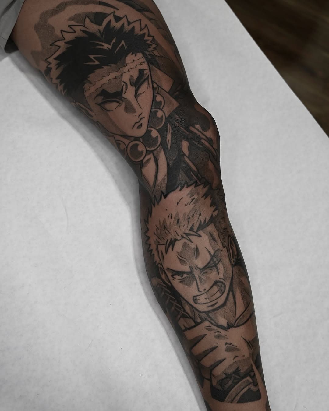 Healed Zoro and Gyomei from a sleeve I just finished up! Big thank you to my dude Jonny for flying out from Colorado a bunch to get his leg done by me this past year 🖤🖤🖤

Done with @allegoryink @bishoprotary 

•

#animetattoo #animetattoos #zoro #gyomeihimejima #onepiece #onepiecetattoo #demonslayer #demonslayertattoo #blackwork #blackworktattoo #animetattooartist #michigantattooartist #michigantattooers #allegoryink #bishoprotary #emallatattoosupply #emalla