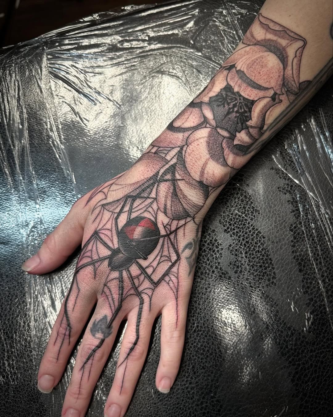 Had fun with this one!! I love creating pieces like this that combine elegance and edge!
Done @depictiontattoos in Arlington, Texas, using @sacred_tattoo_ink Now taking on more custom designs—DM to book your next Tattoo!!! 

#BlackAndGreyTattoo #BlackWidowTattoo #PeonyTattoo #OrnamentalTattoo #HandTattoo #ArmTattoo #TattooDesign #TattooArt #TattooArtist #CustomTattoo #DetailedTattoo #FineLineTattoo #BoldTattoo #TattooInspiration #TattoosOfInstagram #TattooCommunity #InkedAndProud #DepictionTattoo #SacredInk #ArlingtonTattoo #TexasTattooArtist #NowBooking #BookYourTattoo #TattooCollector #ModernTattooArt #FloralTattoo #SpiderTattoo #TattooGoals #TattooLife #TattooLover