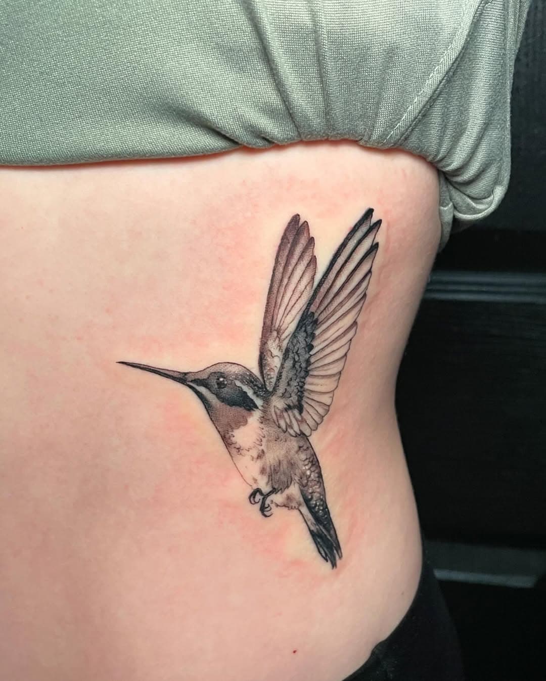 Humming bird tattoo on the ribs. Her first tattoo! Handled it like a champ! We’re going to add some florals next session. Looking forward to more black and gray tattoos this year. 😊 
✨ DM me with your availability to book a consultation! Let’s get a new tattoo going for you. Or, let’s spruce up an existing tattoo you have. 😊
