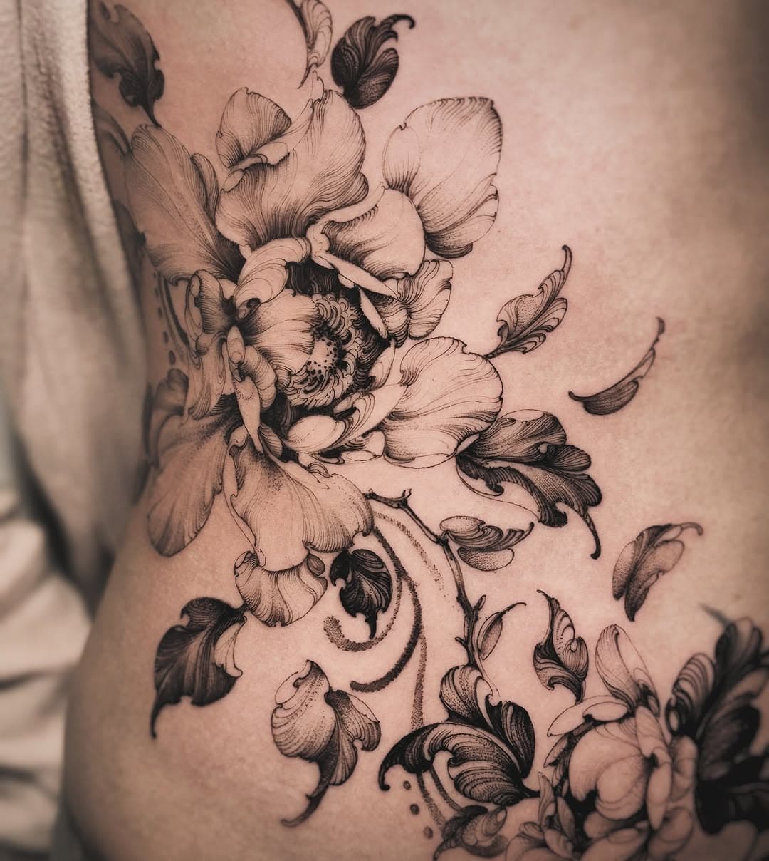 “Elegance in bloom ✨ This delicate flower tattoo flows beautifully with the body’s natural curves. Loved bringing this piece to life for my amazing client! What do you think? 🌸💉
In Poland now you can find me at @xy_studio_ 🇵🇱

Soon @rockthecoasttattoo 🇩🇪
#PeonyTattoo #FloralTattoo #InkArt #TattooArtist #TattooStudio #TattooWork #SideTattoo #FineLineTattoo #TattooLover #TattooInspiration #TattooAddict #BodyArt #TattooIdeas #TattooLife #FlowerTattoo #BlackAndGreyTattoo #InkedGirls #TattooPassion #TattooDesign #InkedUp”