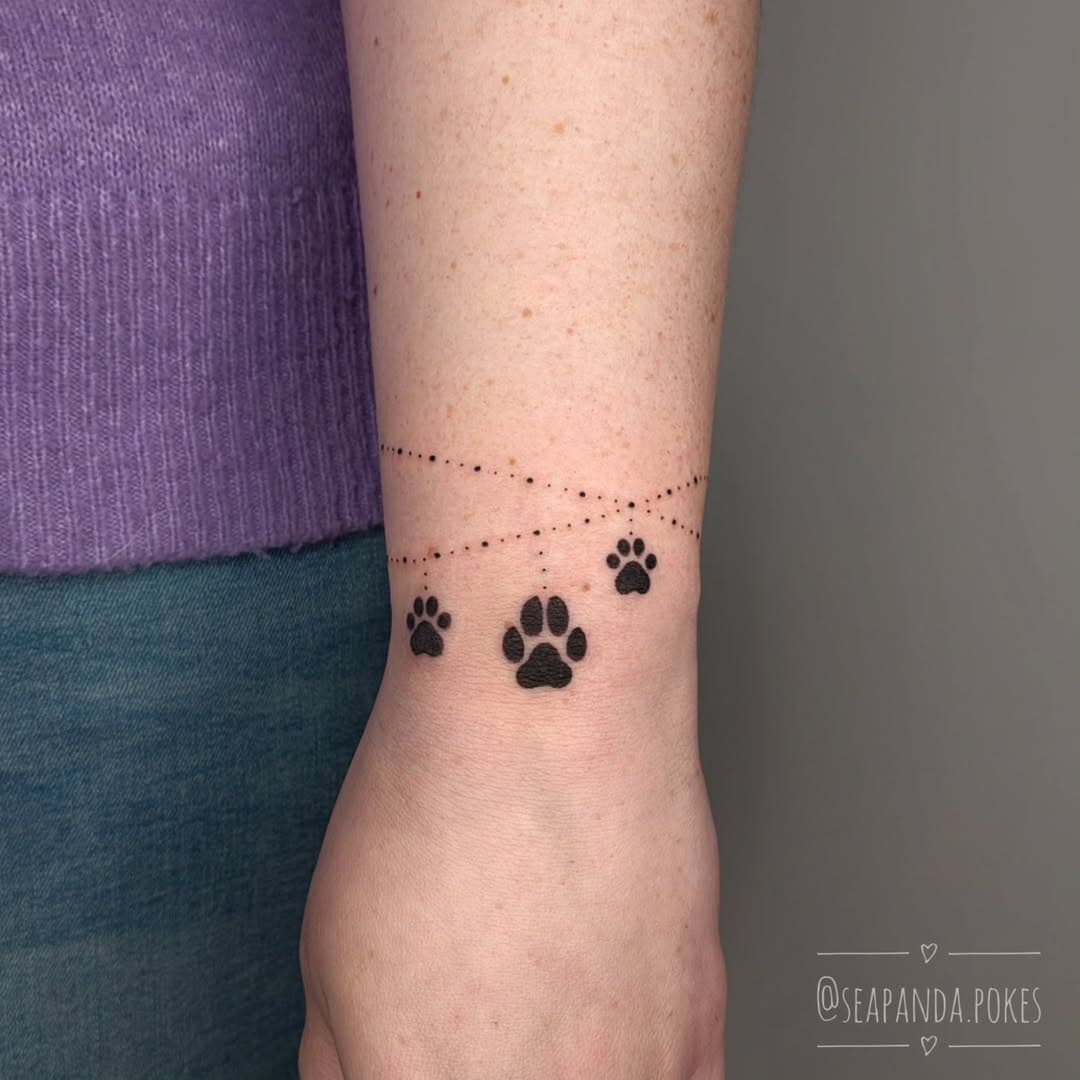 Posting some backlog tattoos while I am healing from surgery.
I might not post it often but I love doing tattoos to honor your dearest pets 🐾 
The paws were stenciled and the bracelet freehanded on! 
Thank you so much @grumpykittencosplay for the lovely session, fun talks and to make you smile and happy 😁 

°°°°°
My bookings for April 2025 are open!
(March is fully booked)
You can also apply to fill a spot during a cancellation 😊
Due to me having surgery at the end of this month I won't be working in February.

@de.prik.makkers - Utrecht
@itaitattoo - Den Haag

Fill out my booking form through the link in my bio!
Check my pinned post for tattoo booking info. If you have any questions feel free to send me a DM or email ☺️