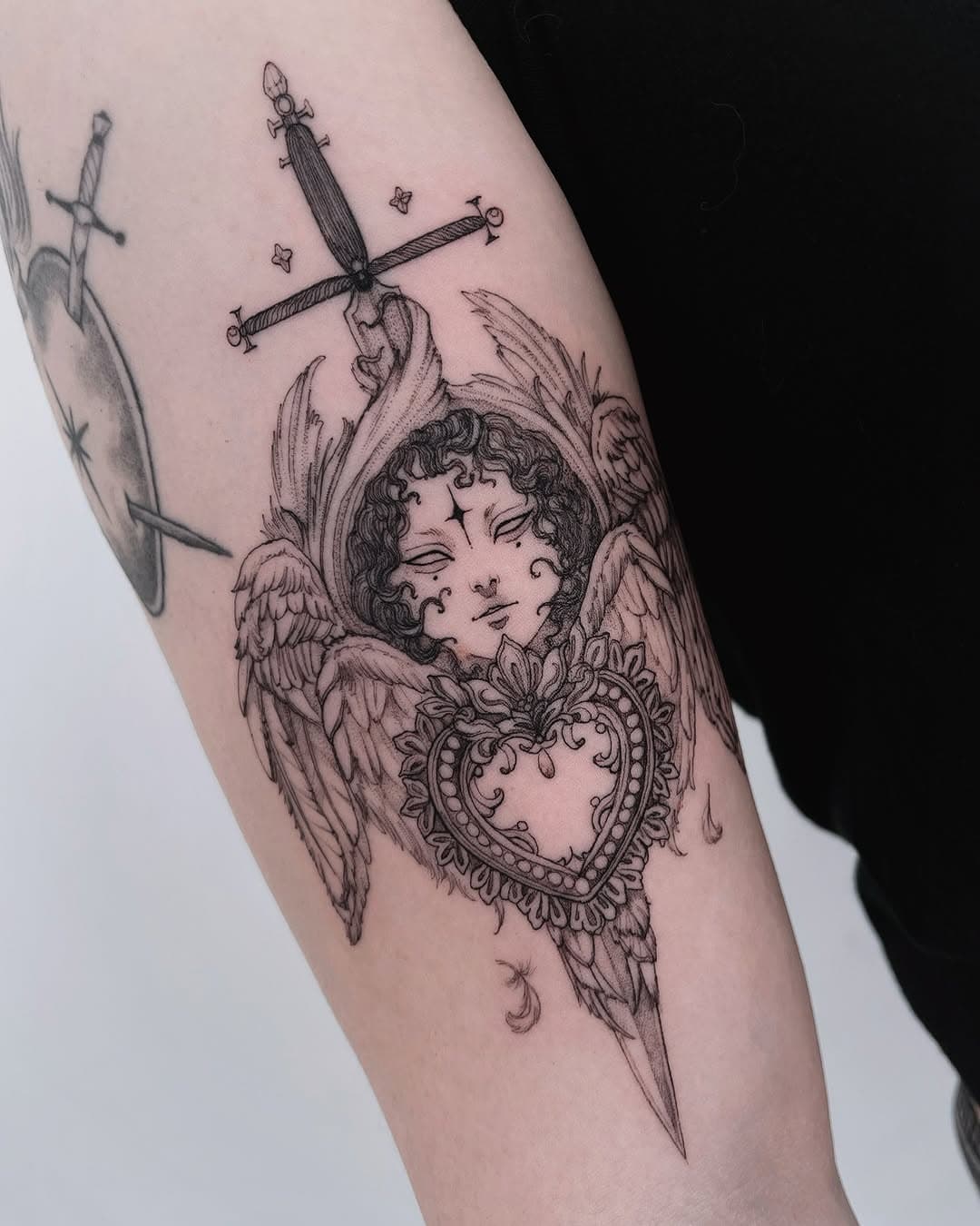 Little seraphim for lovely @stramonium.art 🤍 Check out her amazing jewelry!
.
#tattoo #seraphim #angeltattoo #cupidtattoo #tatuagem #tattoolisboa #btattooing #skinartmag #lisbontattoo #tattooistartmag #fineline #ladytattooers