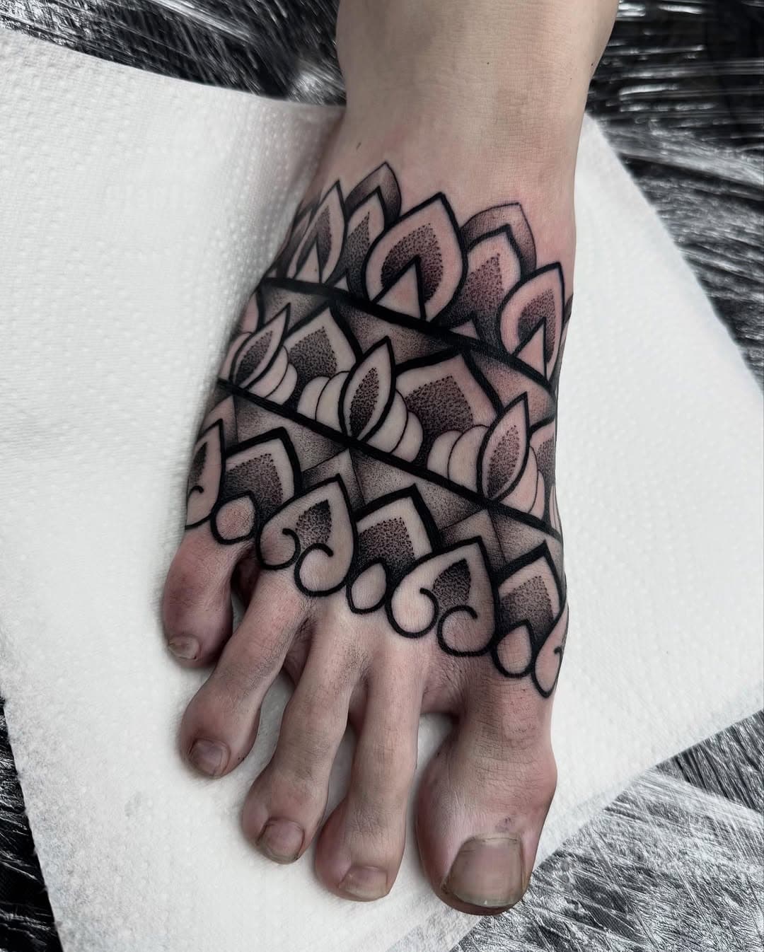Foot tattoo today for @jackburgess4 #foottattoo #feetpics #feetpic #footpics #tattoo #dotwork #dotworktattoo #geometricart #geometrip #geometrica #geometripsmall #blackworktattoo @portlandstreettattoo