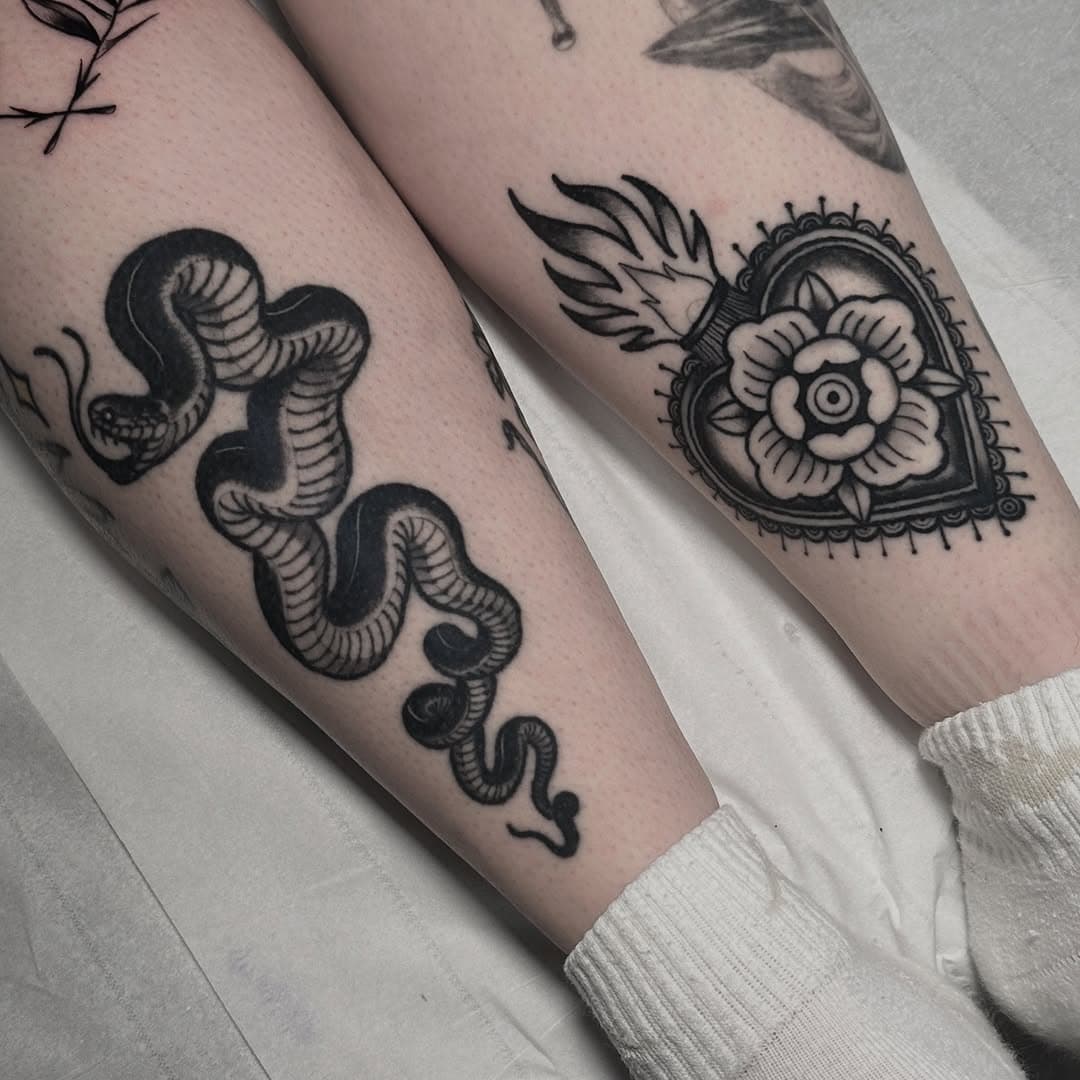 Couple of healed black work tattoos on Chloe. These healed up a treat and nice to see them!  If you want to book in please send me a message and I’ll get back to you as soon as I can! #tattoo #blackwork #blacktattoo #boldtattoo #healedtattoo #healed #trad #trafitional #snake #snaketattoo #heart #sacredheart