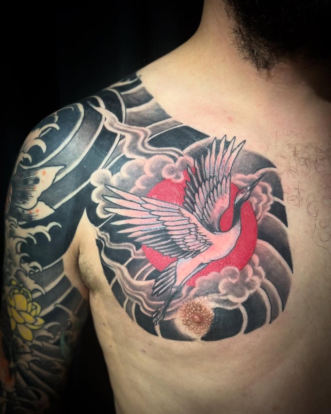 Finished Menco’s chest plate today. Originally he wanted a 3/4 sleeve, which we extended to a full sleeve, which we eventually extended to a full sleeve plus chestpanel. Ill adapt to your wishes ☺️ Thanks my Guy! #theofficetattoo #theofficetattoos #crane #cranetattoos #japanesecrane #japanesecranetattoo