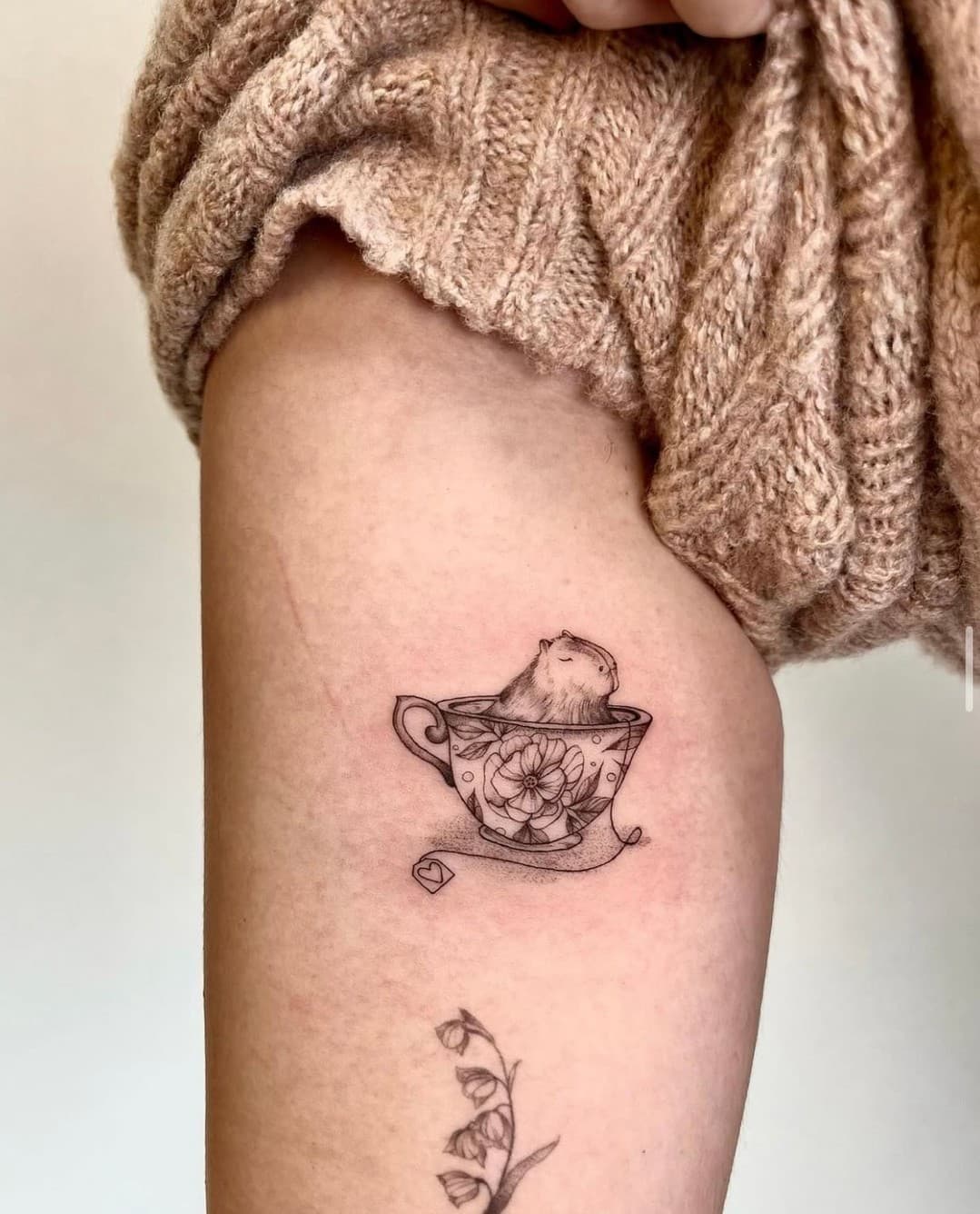 Capybara cutie by Aline @ecoart_tattoo #teacuptattoo #daintytattoo #finelinetattoo #capybara #sippingonserenity #naturetattoos