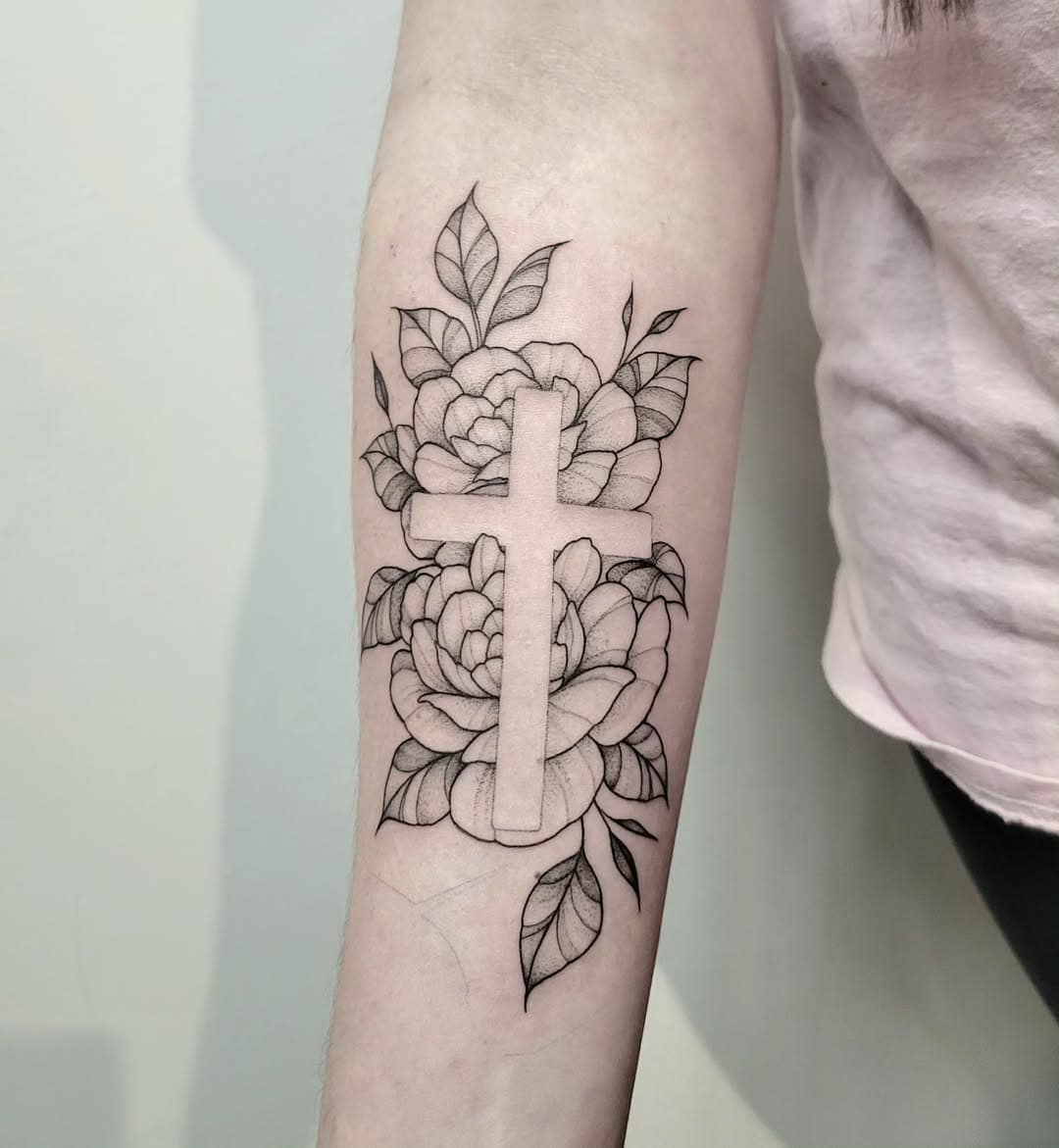 Negative space floral and cross from yesterday, loved how she turned out and couldn't wait to post! This was a first tattoo and she sat so well

#tattoo #floraltattoo #finelinetattoo #stippletattoo #flowertattoo #armtattoo #femaletattooartist