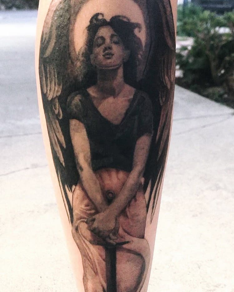 An angel on the calf, from my flash sheet. I gotta bring the client in for a touchup and a better picture.