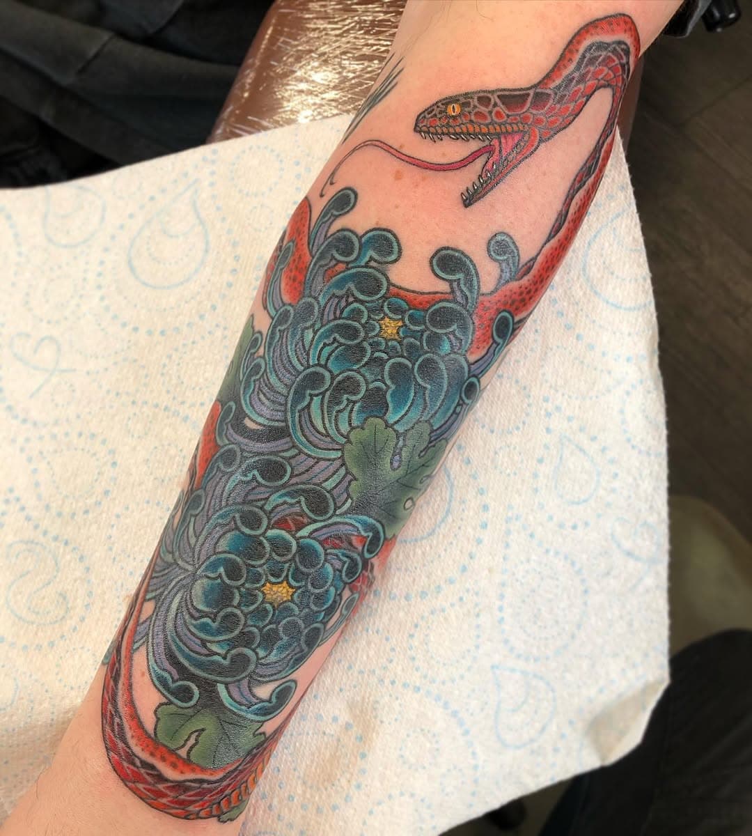 COVER UP , chrysanthemums healed , snake colour is fresh , swipe for the tribal and dragon that was before 🥵🙏🏼 #cosmictattoo #japanesetattoo #japanesesleeve #japanesetattoos #japaneseart #snaketattoo #snake #japanesesnake #flowertattoo #chrysanthemumtattoo #colchestertattoo #essextattoo