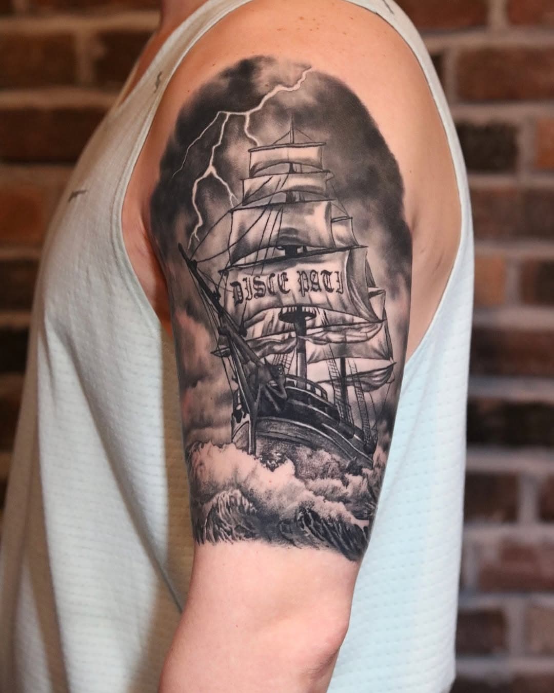 Through the storm, we learn to endure. 🌊⛵️ On one side, an old ship braving the chaos, marked with Disce Pati—‘Learn to suffer.’ On the other, the calm after the struggle—a beautiful beach, the reward for perseverance. Life tests us, but every storm leads to a shore. 🌅 

#TattooWithMeaning #DiscePati #StormAndSerenity” #tattoo #tattoos #realismtattoo #realistictattoo #shiptattoo #oldshiptattoo #oldship #blackandgreytattoo #realistictattoo #beachtattoo #tattooartist #tattooer #realismtattooartist #vancouvertattooartist #newwestminstertattooshop