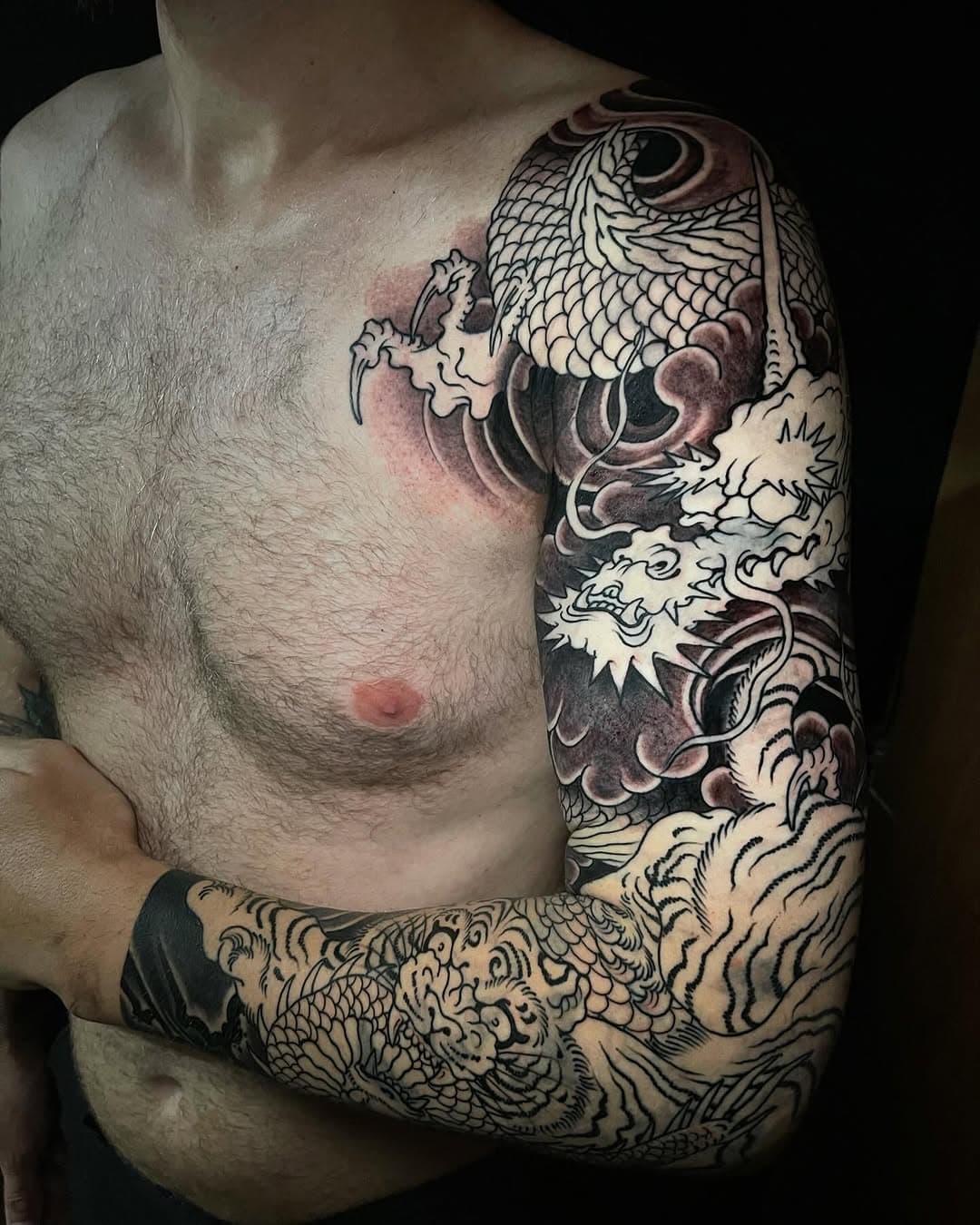 Good start to Travis’s dragon & tiger sleeve. Colour next! 
For booking info email 📮tattoo.adrianhing@gmail.com🌞