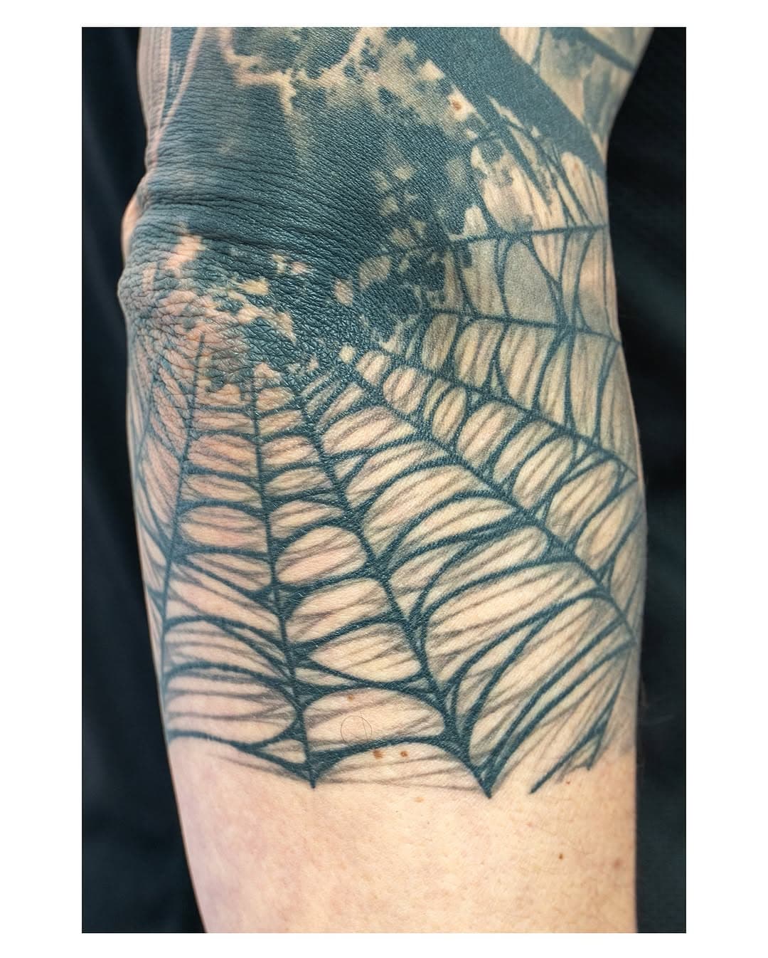 Got a nice healed shot of @dc_grebo elbow webs the other day and then we started doing some black work mech on his other arm! Can’t wait to do more on it! @bridgendtattoo @barber_dts #healedtattoo @cheyenne_tattooequipment @criticaltattoosupply #webtattoo #blackandgreytattoo #southwales #bridgend