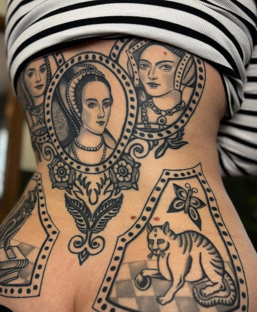 A little peek at Jasmine’s back that we’ve been working on for a little while. Jasmine is a history buff and wanted a nod to that (this is the second Anne Boleyn tattoo we’ve got to do together over the years). The cats are were made to resemble her own cats but a little uglier as an ode to the old ugly paintings of cats. Thank you very much @jasminec_w 🥰 #tattoo #tattoos #traditionaltattoo #traditionalartist #traditionaltattoos #backtattoo